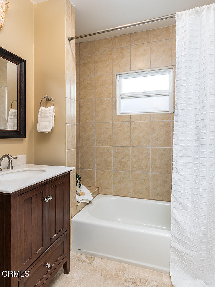 2250 Cooley Place Pasadena, CA 91104 - Photo 23 of 31 a bathroom with a granite countertop sink a toilet and shower