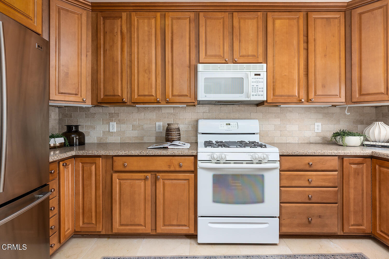2250 Cooley Place Pasadena, CA 91104 - Photo 9 of 31 a kitchen with granite countertop white cabinets and stainless steel appliances
