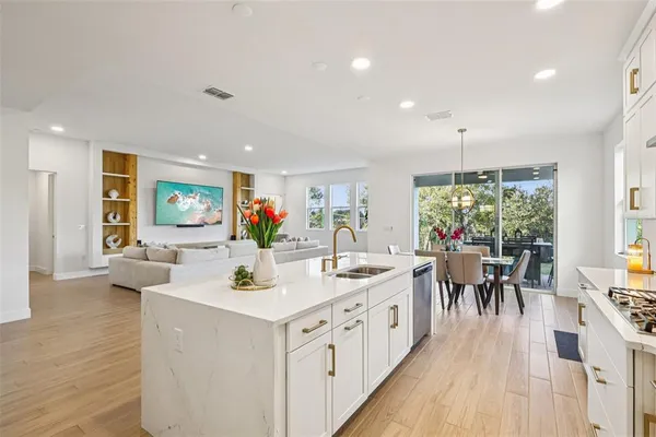 a bedroom with a bed and flat tv screen