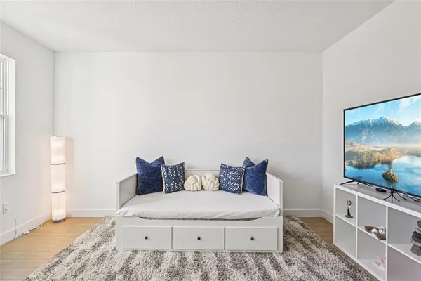 a bathroom with a sink a toilet a shower and a mirror