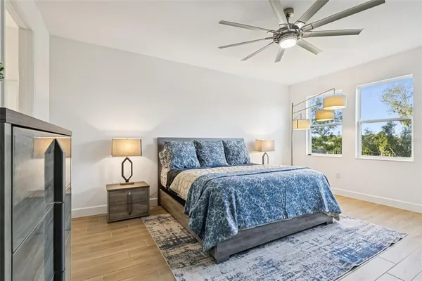 a view of a dining room with furniture and a floor to ceiling window