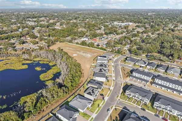 a view of a terrace with a bench and trees