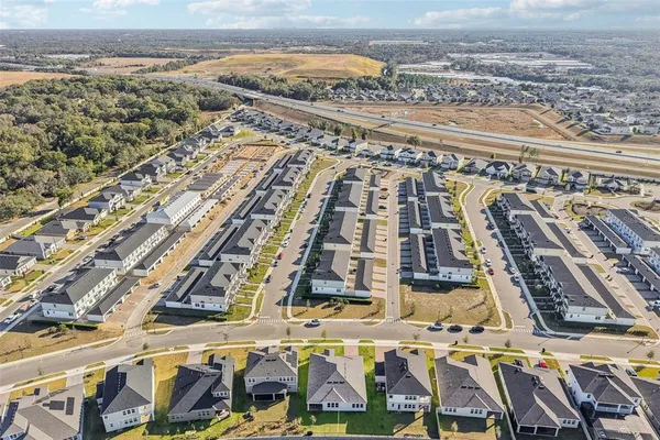 a view of a house with swimming pool and a yard
