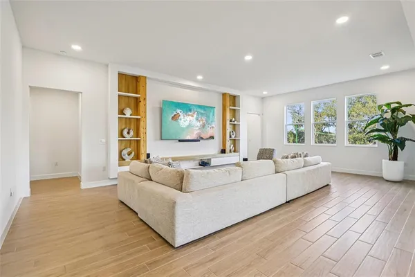 a living room with furniture and a large window