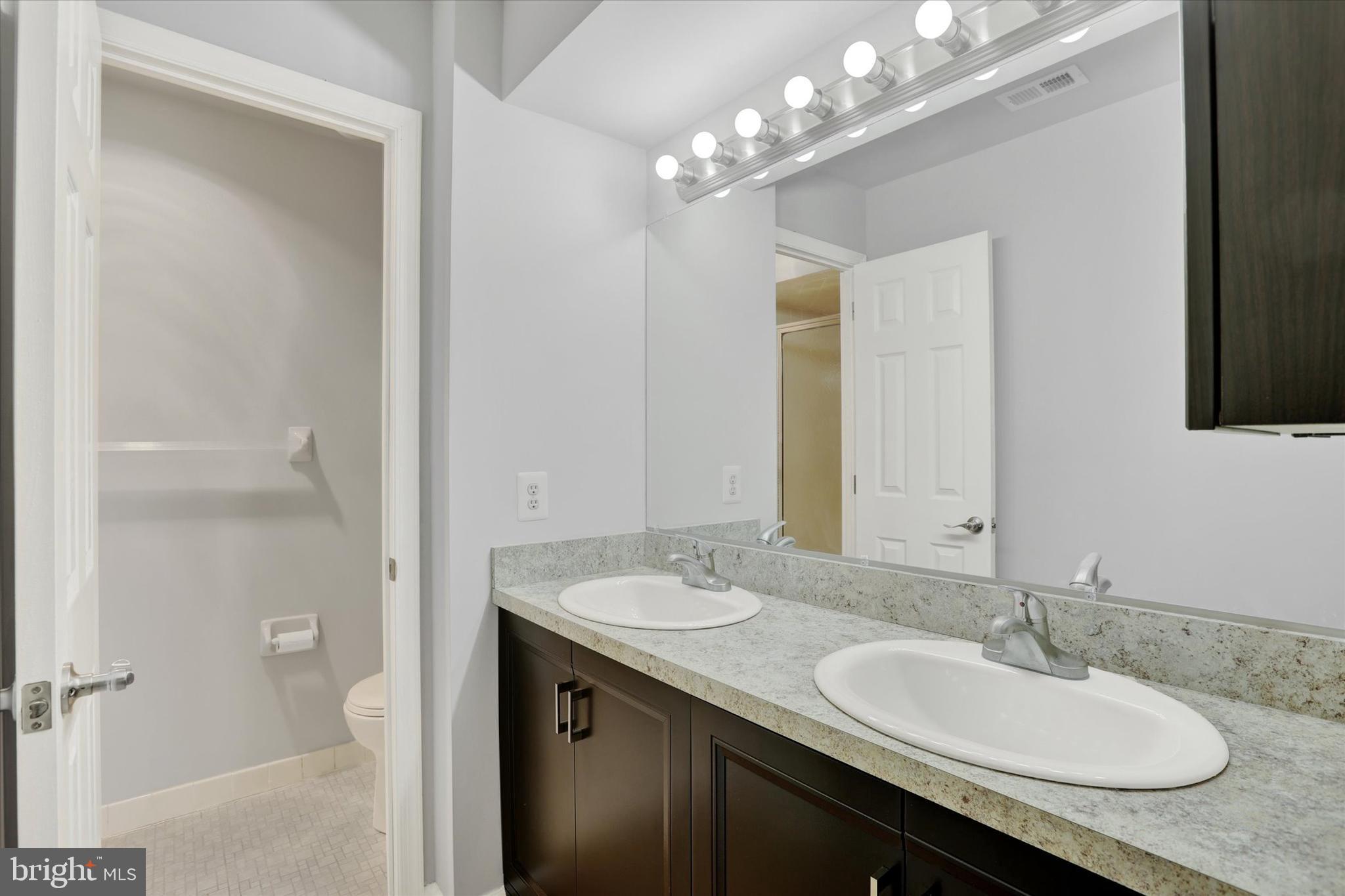 2089 Welsh Road, Unit E1 Philadelphia, PA 19115 - Photo 12 of 17 Main Bedroom with Dual Vanity Sinks