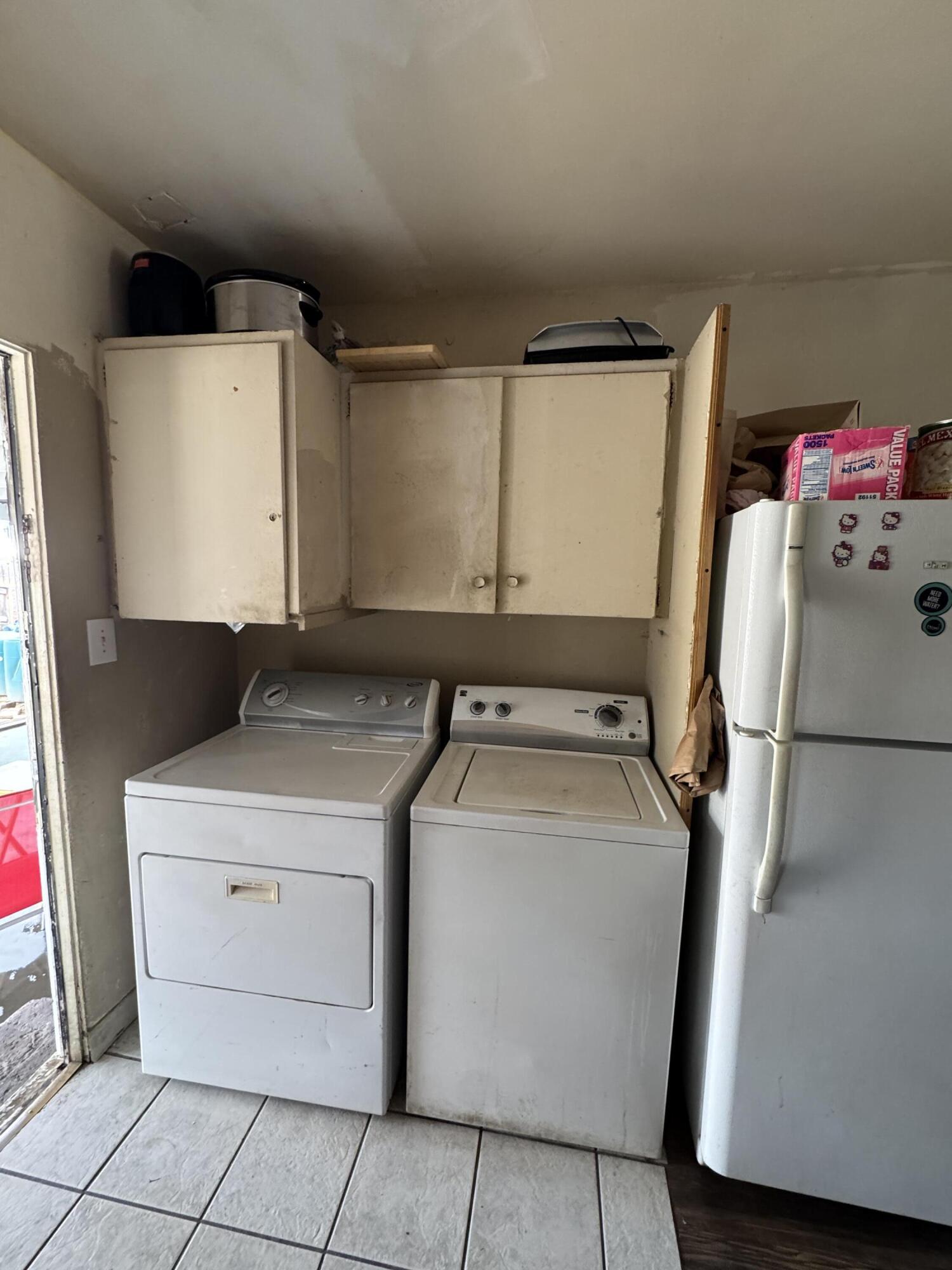 704 North Floral Street Visalia, CA 93291 - Photo 37 of 51 a utility room with dryer and washer
