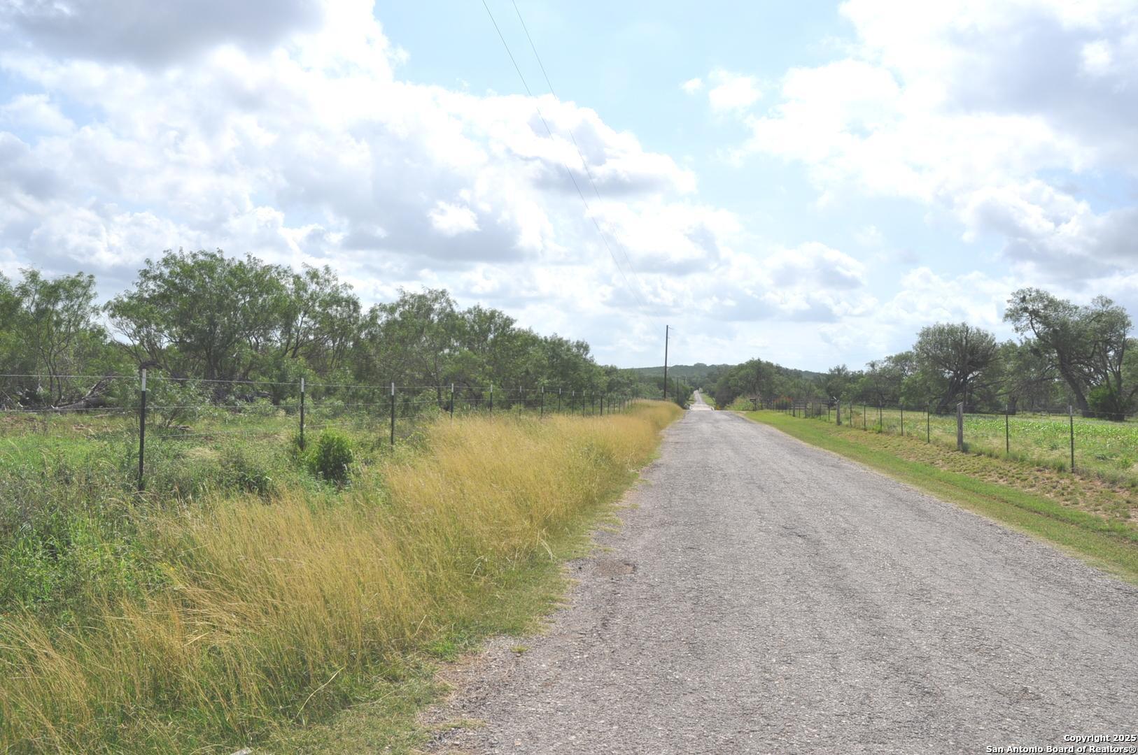 Tbd Cr 662 Devine, TX 78016 - Photo 8 of 8 a view of a lake from a yard