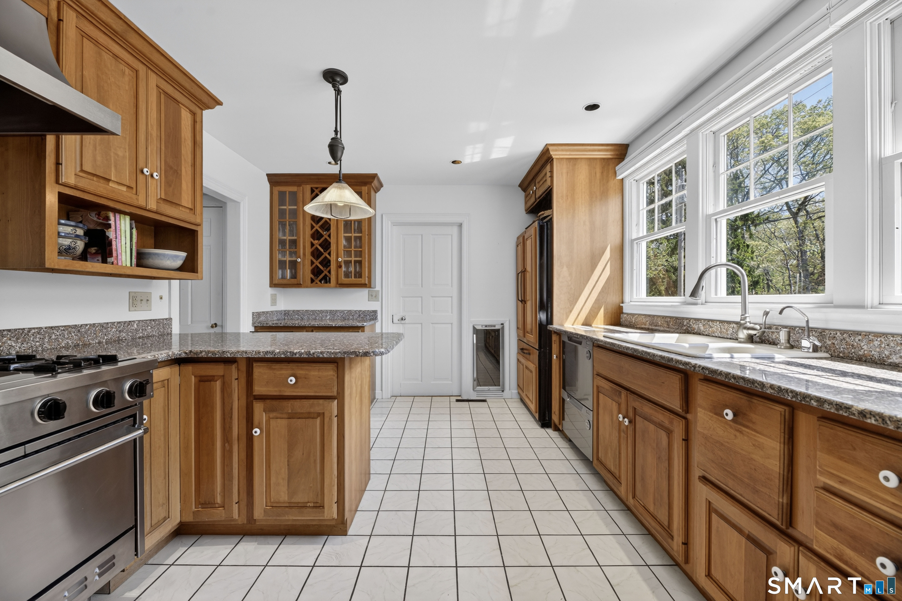 32 Money Point Road Stonington, CT 06355 - Photo 11 of 40 a kitchen with stainless steel appliances granite countertop a stove a sink and a granite counter tops