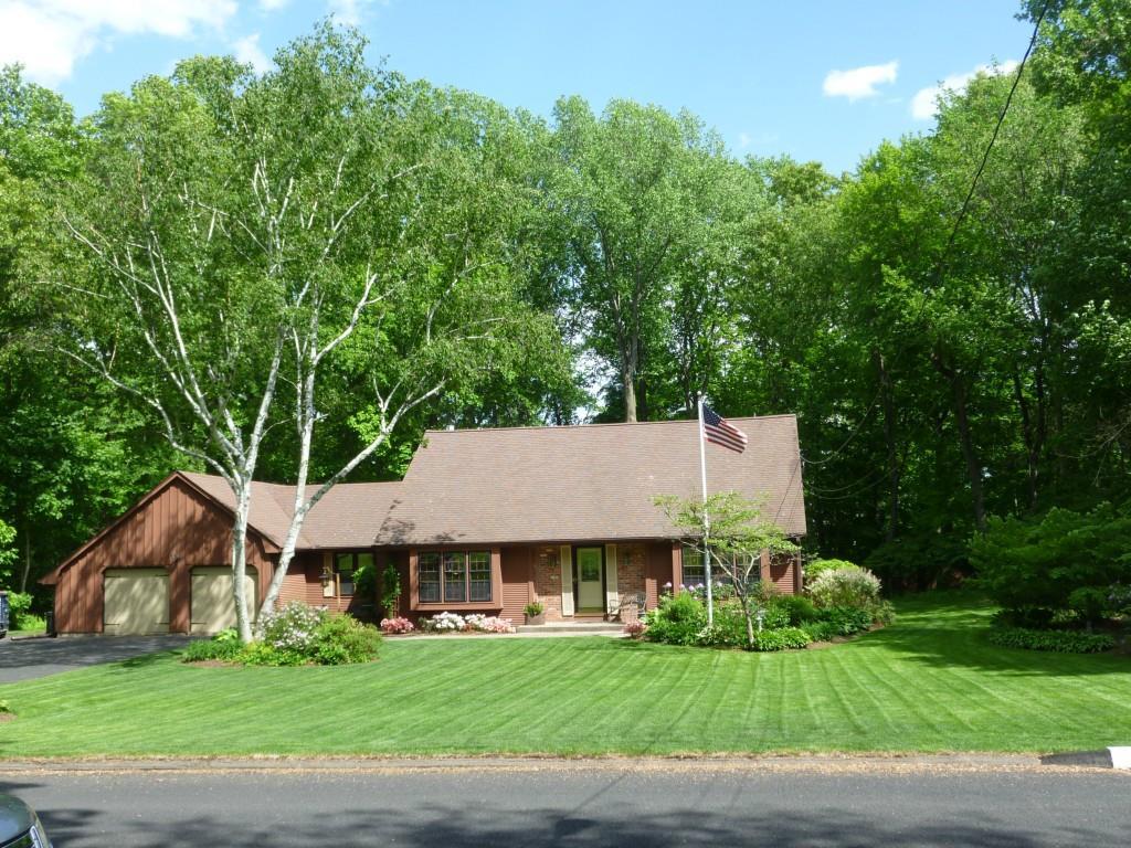 This lovely expanded Cape sits on a beautifully landscaped lot.