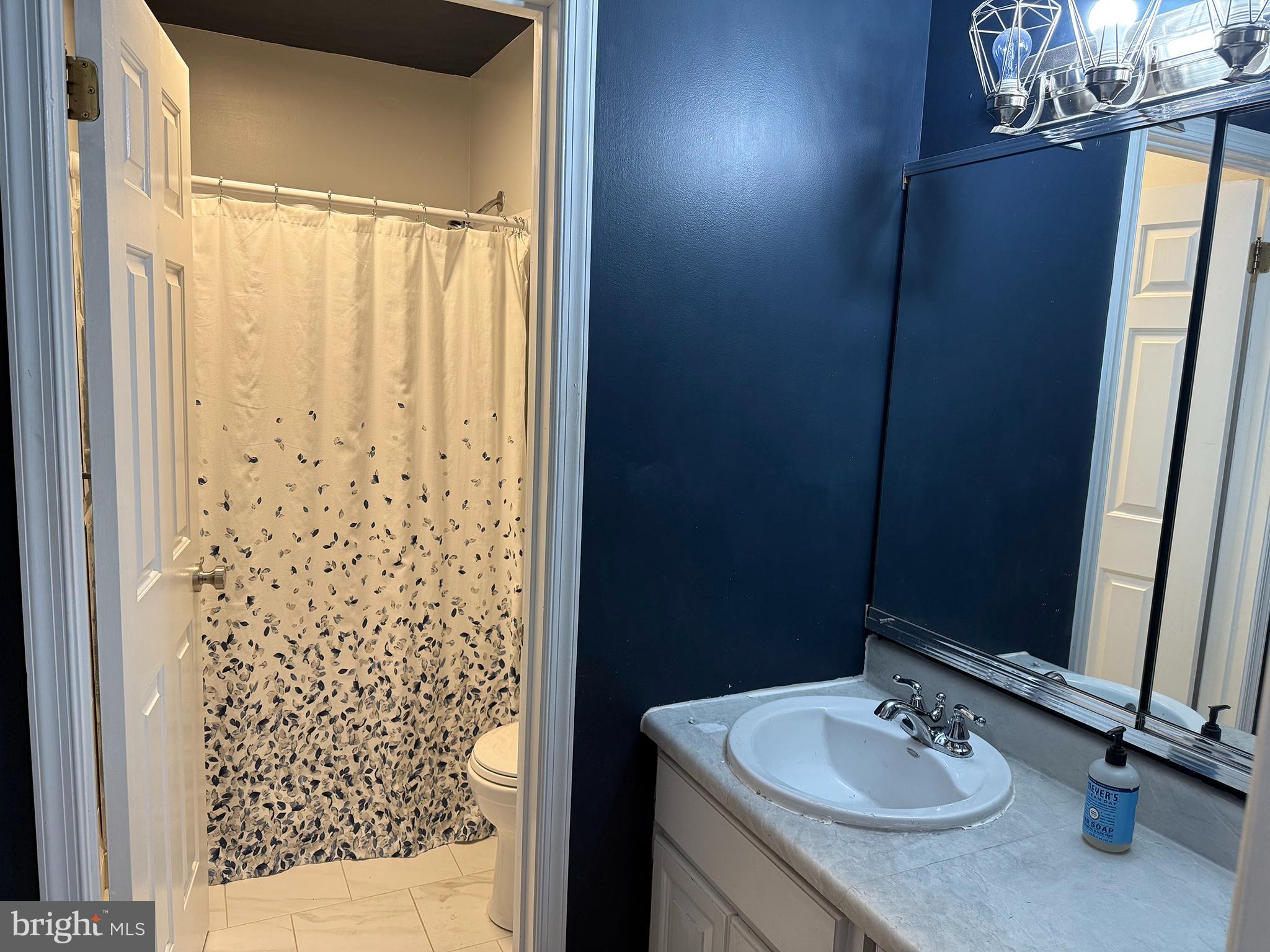 4 Fireside Circle Columbus, NJ 08022 - Photo 11 of 15 a bathroom with a sink and a mirror