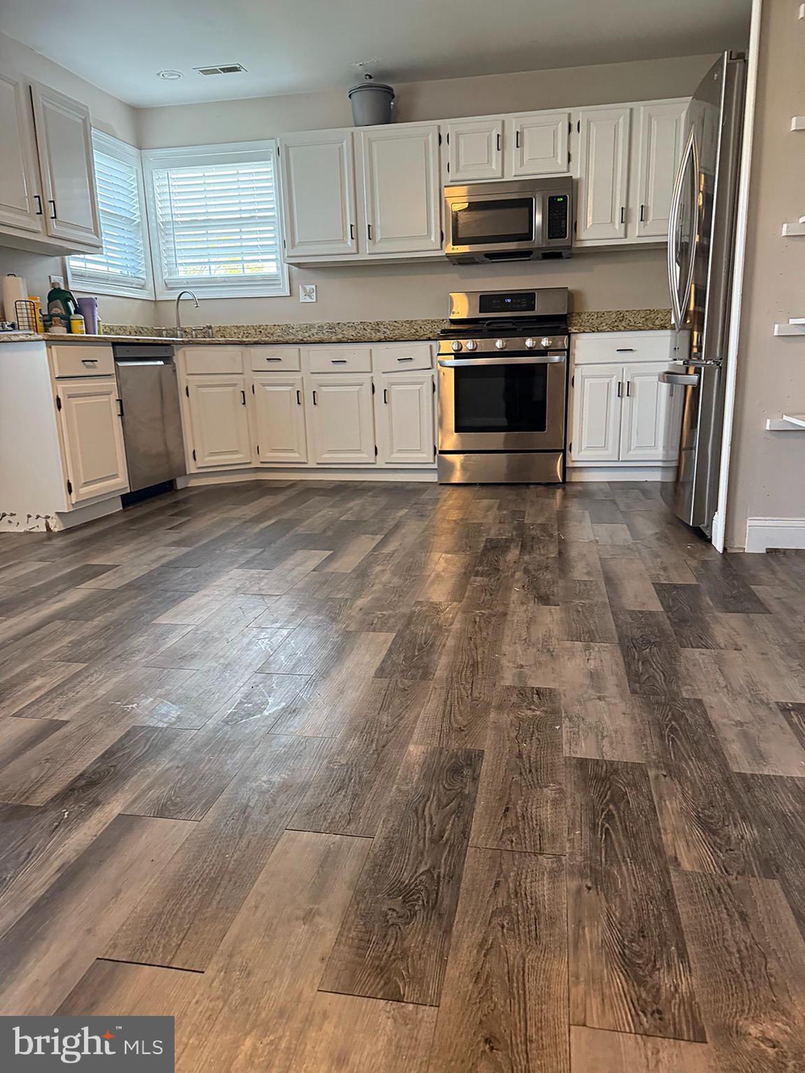 4 Fireside Circle Columbus, NJ 08022 - Photo 4 of 15 a kitchen with granite countertop a refrigerator stove top oven and sink