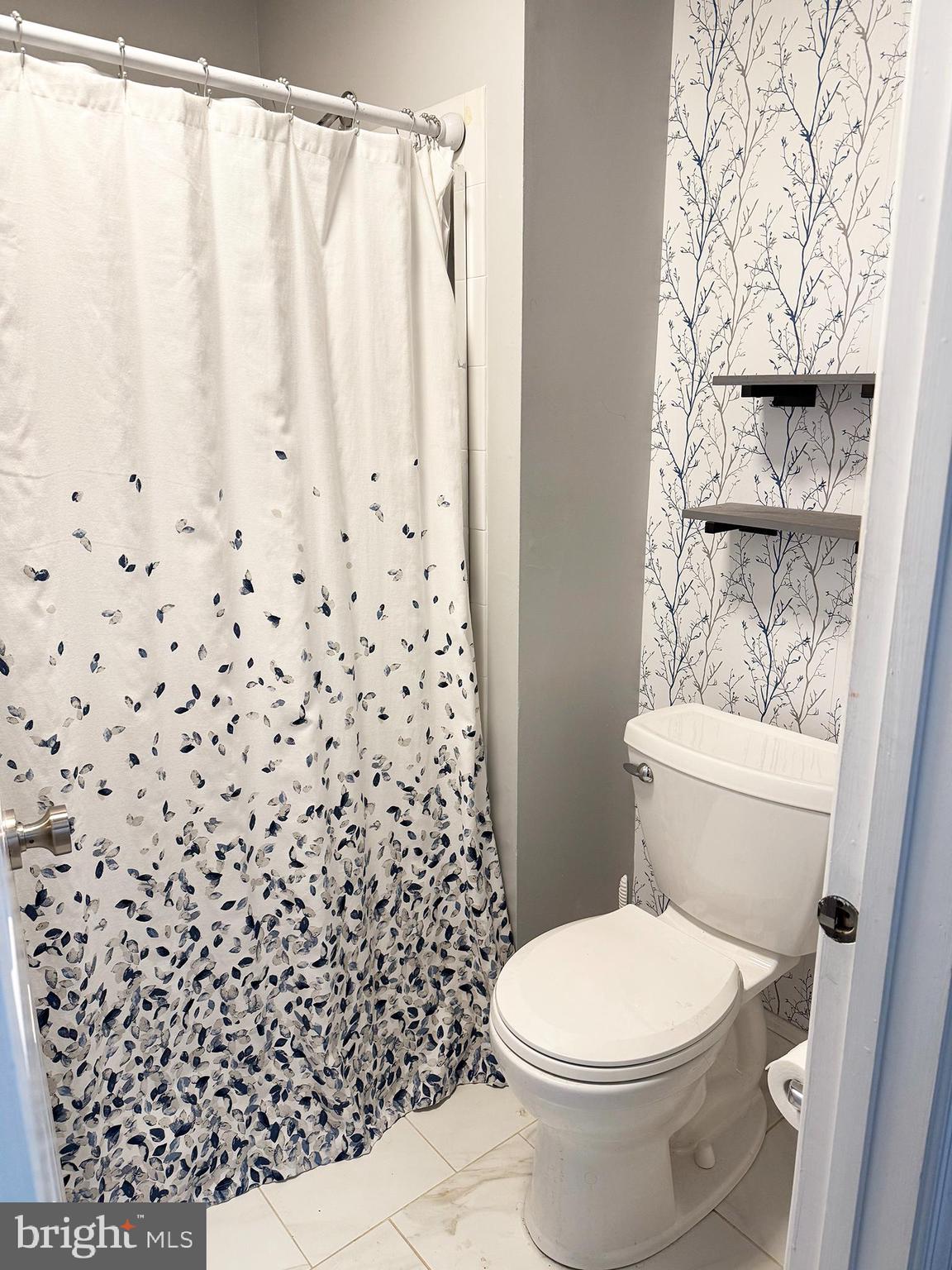 4 Fireside Circle Columbus, NJ 08022 - Photo 10 of 15 a white toilet sitting next to a shower curtain