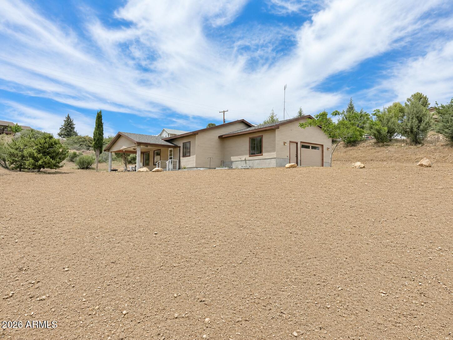 18168 Spoon Road Kirkland, AZ 86332 - Photo 1 of 59 a view of a house with a yard and lake view