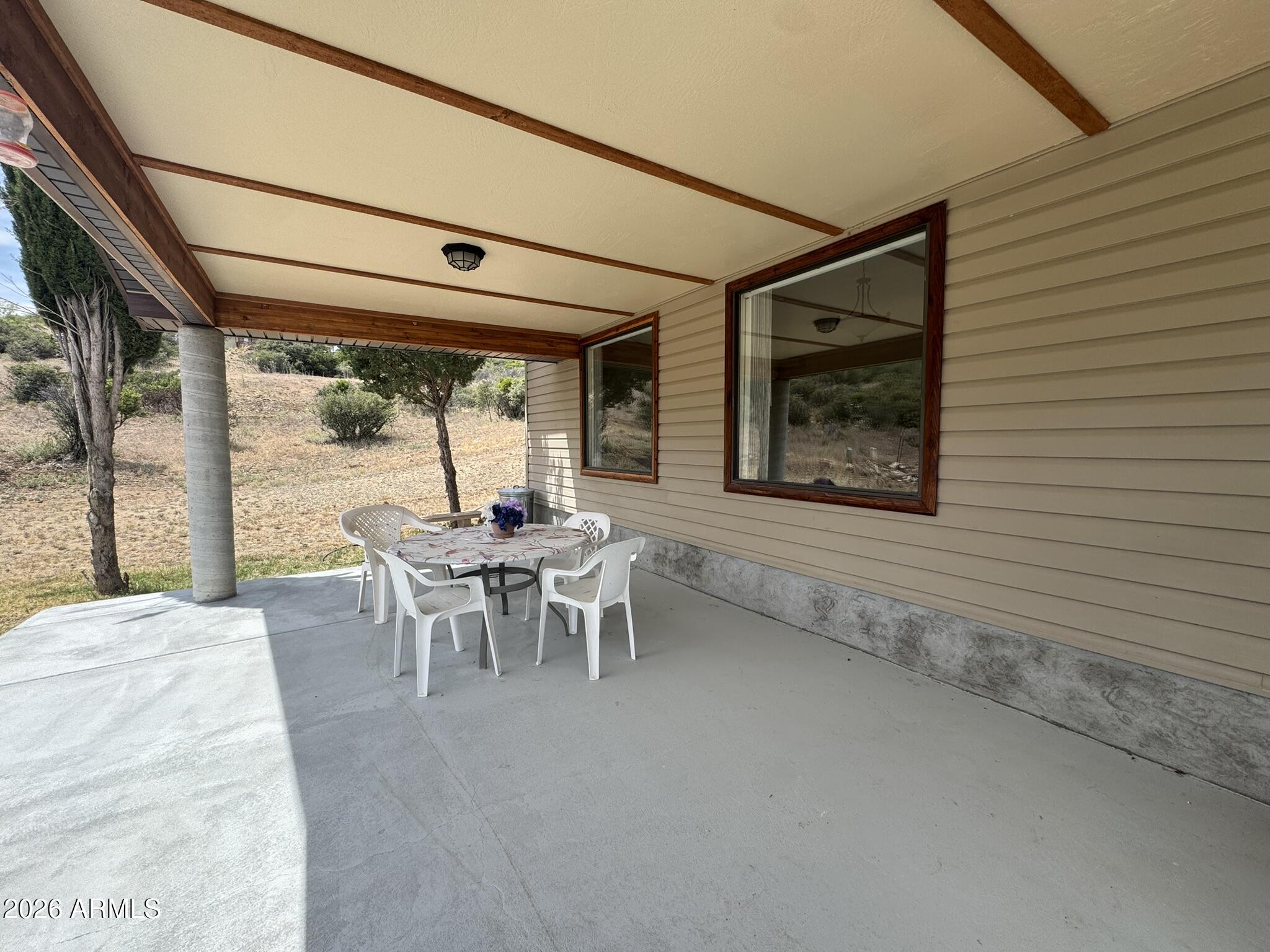18168 Spoon Road Kirkland, AZ 86332 - Photo 12 of 59 a dining room with furniture and window