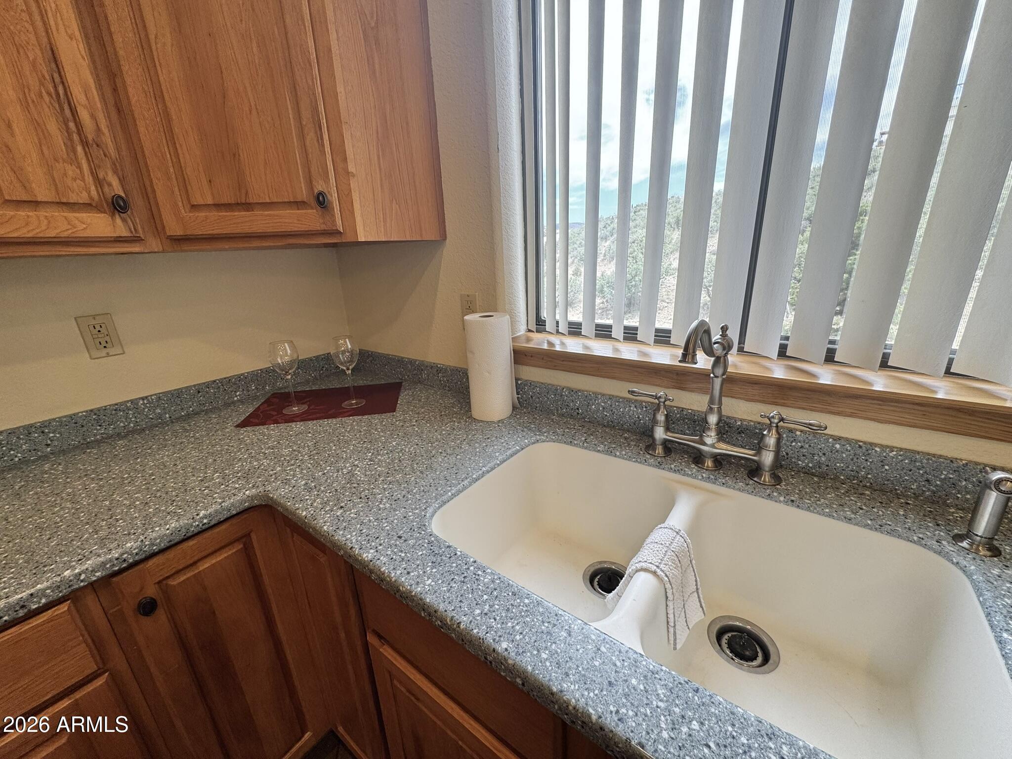 18168 Spoon Road Kirkland, AZ 86332 - Photo 24 of 59 a bathroom with a granite countertop sink and a bathtub