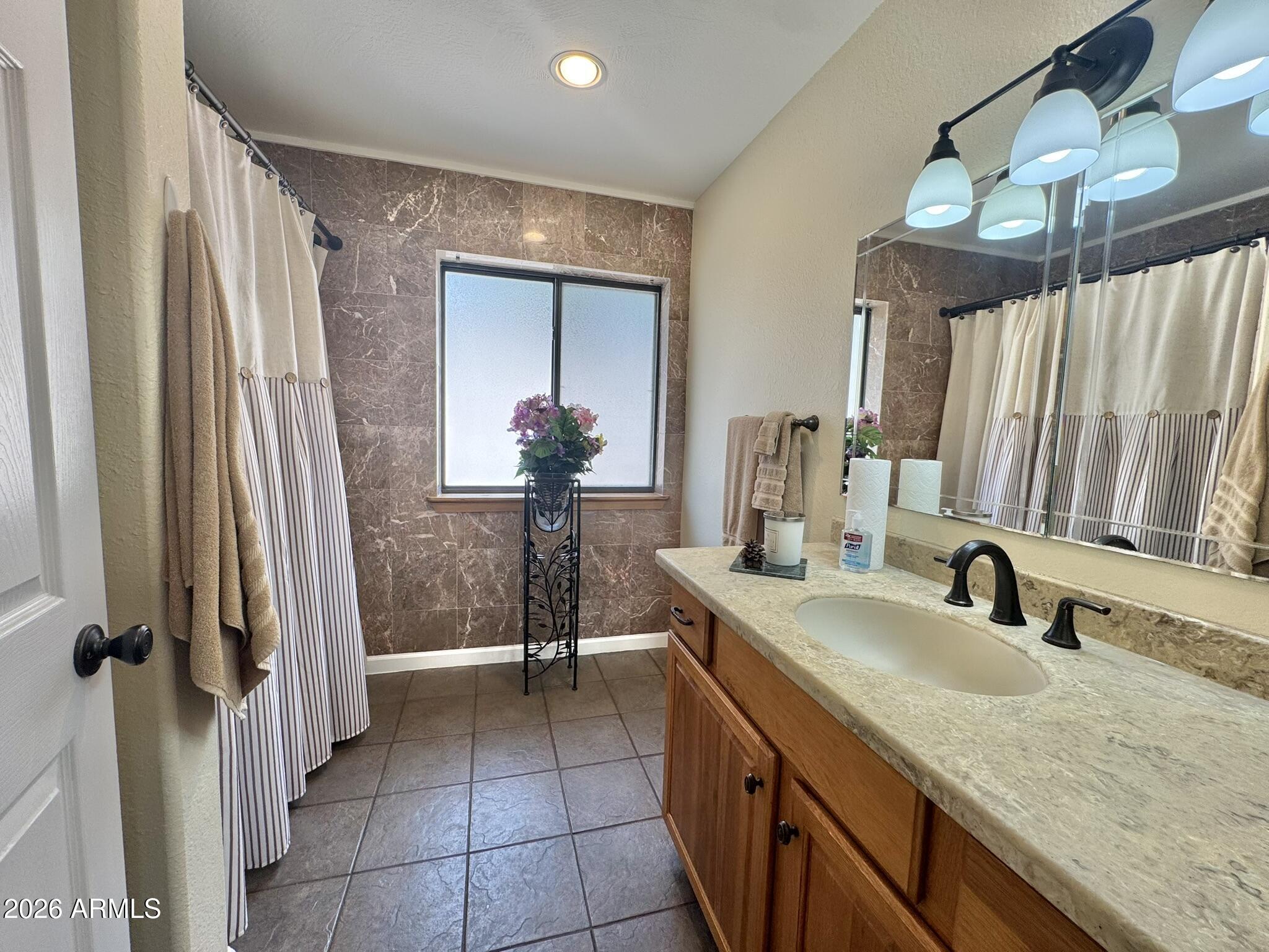 18168 Spoon Road Kirkland, AZ 86332 - Photo 4 of 59 a bathroom with sink shower and mirror