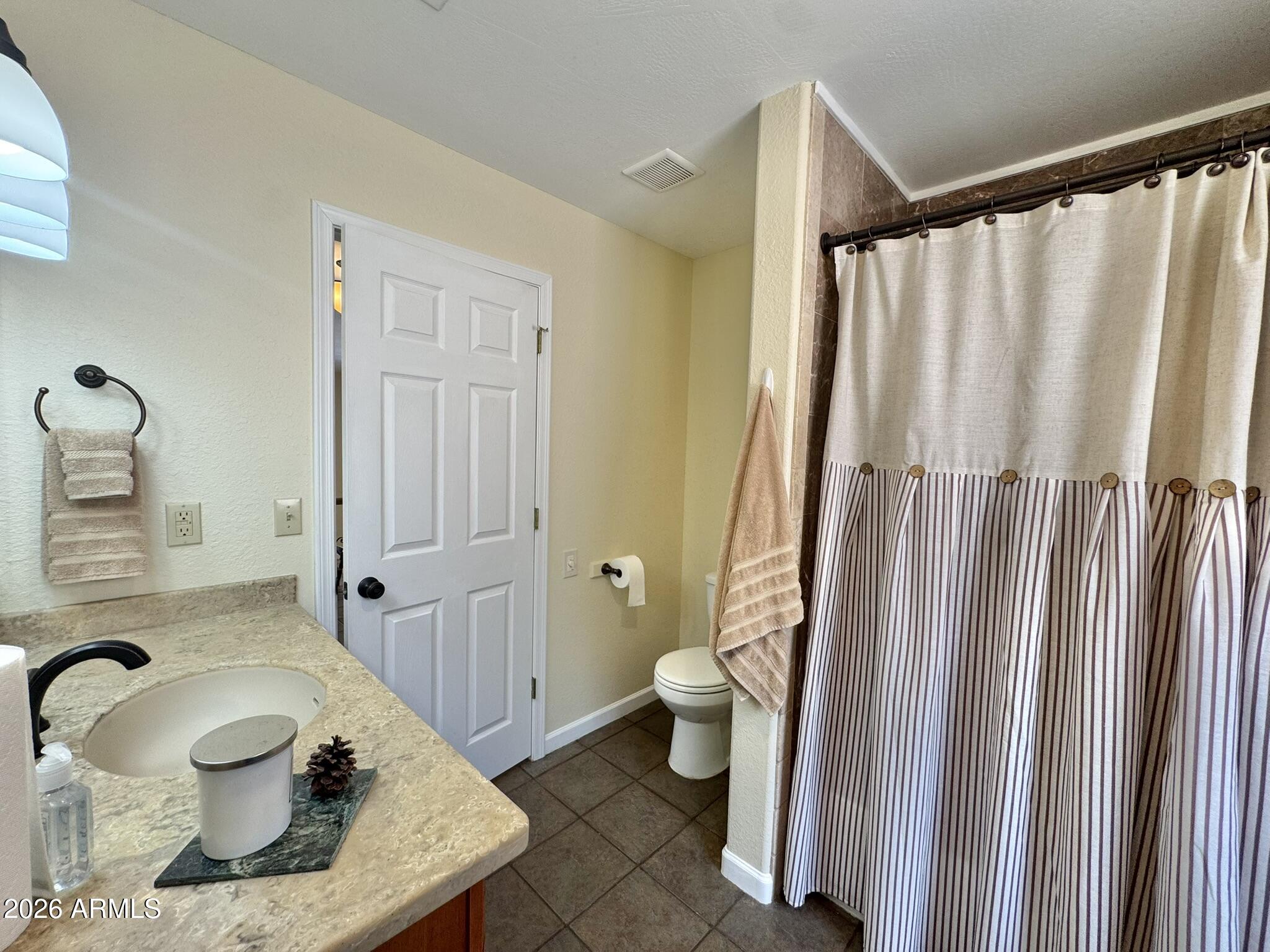 18168 Spoon Road Kirkland, AZ 86332 - Photo 45 of 59 a bathroom with a sink toilet and shower