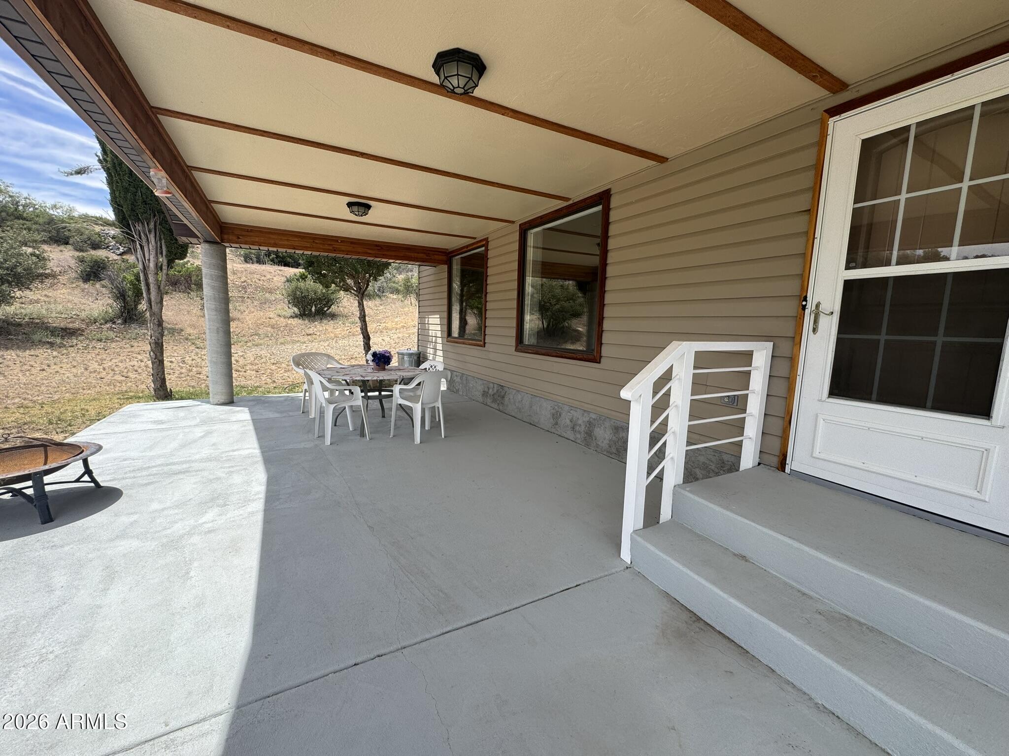 18168 Spoon Road Kirkland, AZ 86332 - Photo 54 of 59 a view of living room and balcony