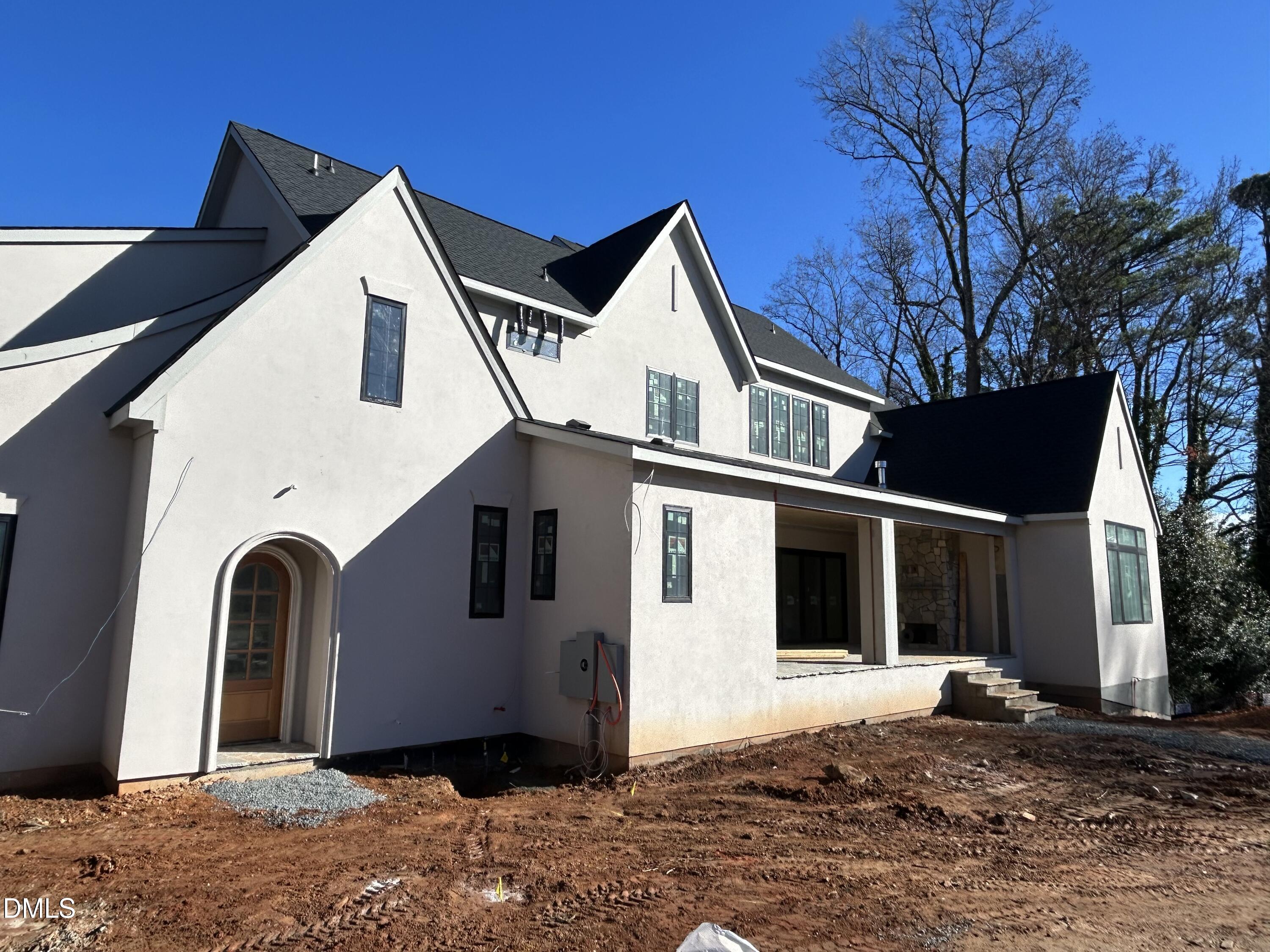 105 Edenburgh Road Raleigh, NC 27608 - Photo 2 of 26 a view of a white house with a yard