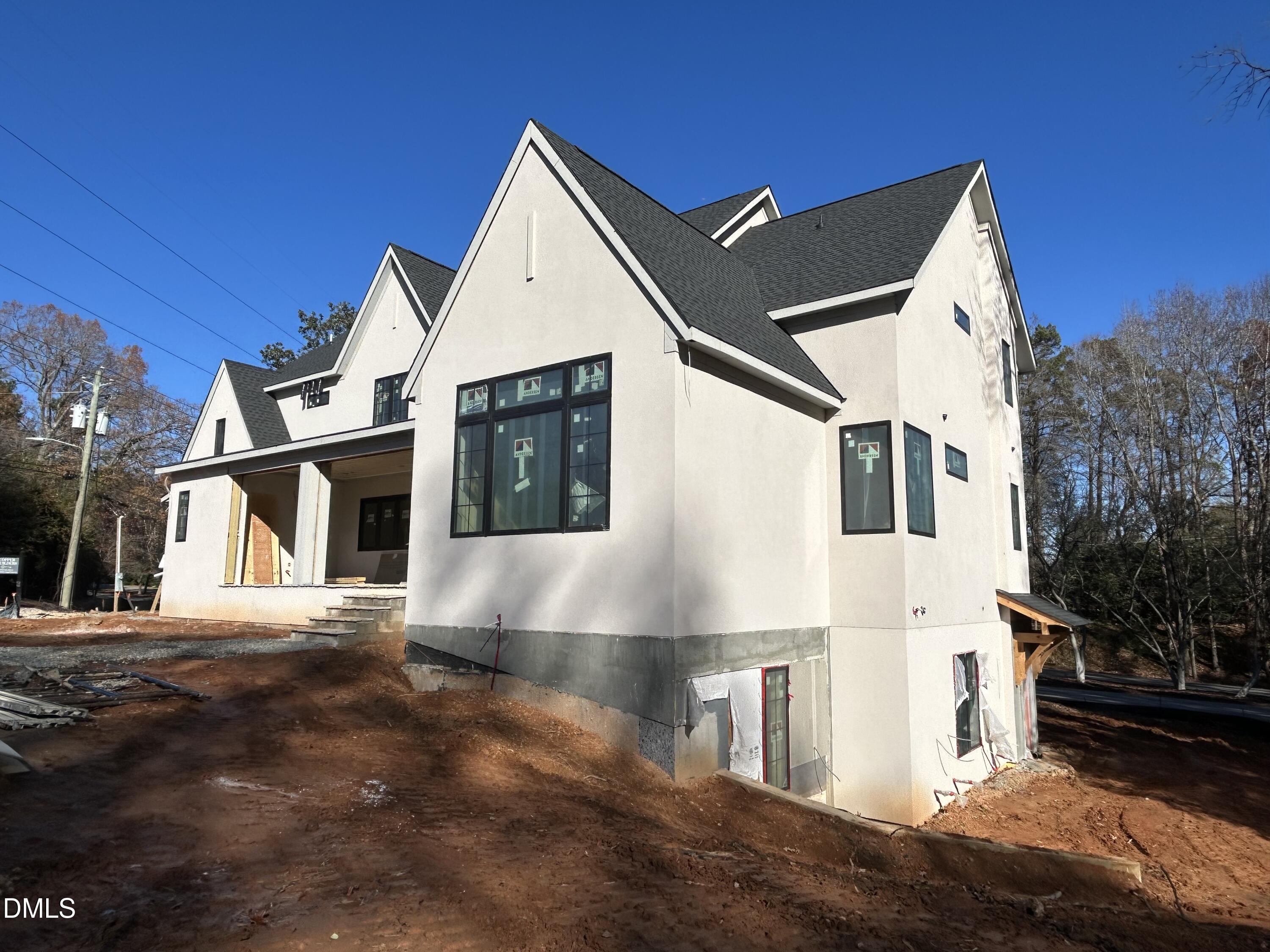 105 Edenburgh Road Raleigh, NC 27608 - Photo 4 of 26 a view of a white house with a yard