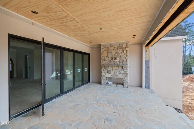 a view of an empty room with closet