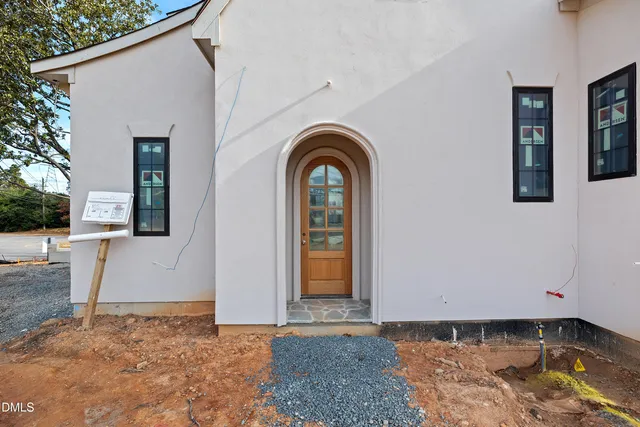 a view of a livingroom with fireplace and staircase