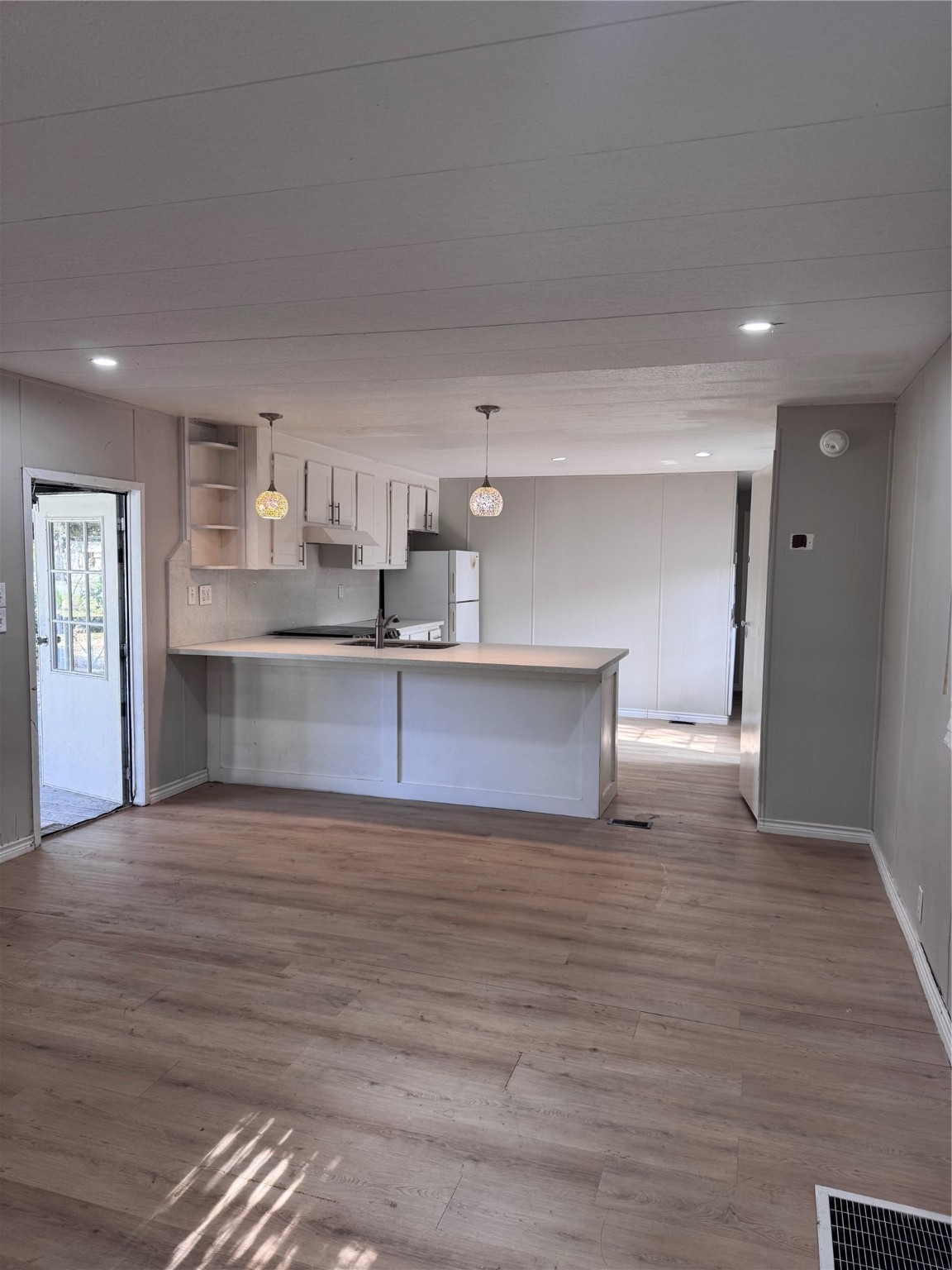 251 Ramp Way Trinity, TX 75862 - Photo 13 of 18 a view of a kitchen with a sink and a refrigerator
