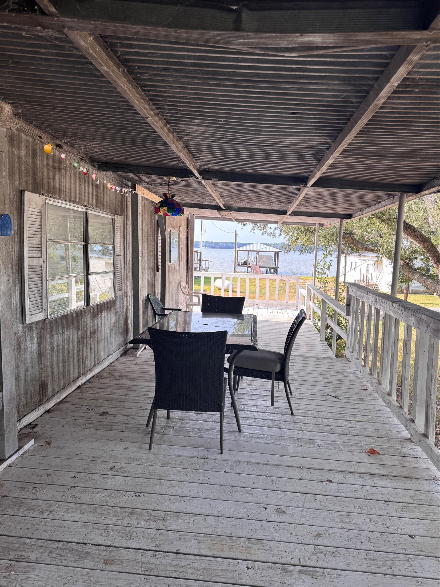 251 Ramp Way Trinity, TX 75862 - Photo 15 of 18 a view of a porch with furniture and wooden floor