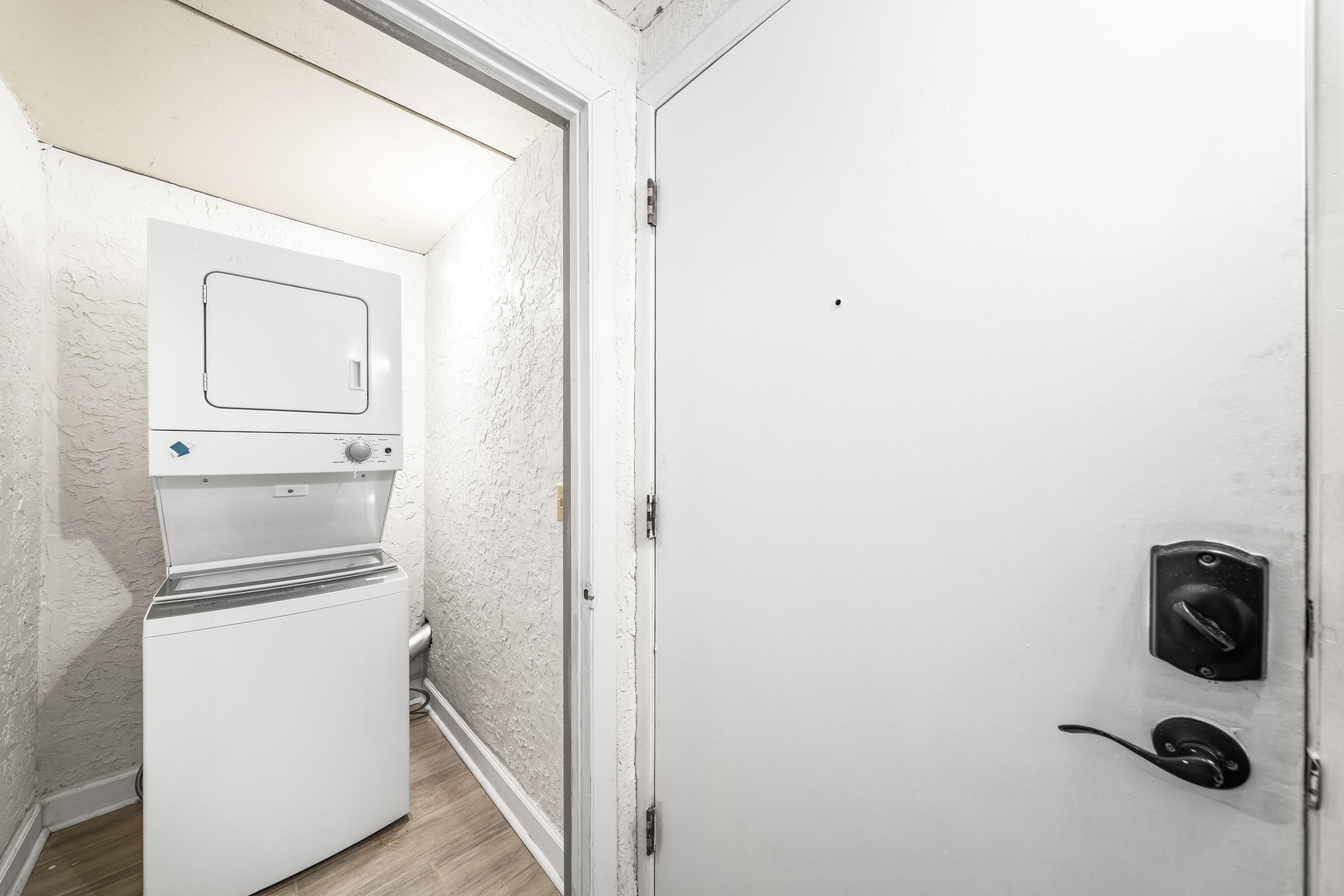 22519 Front Beach Road, Unit 108 Panama City Beach, FL 32413 - Photo 27 of 38 a utility room with dryer and washer