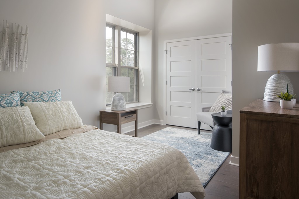 166 Terrace Street, Unit 401 Boston, MA 02120 - Photo 7 of 19 a bedroom with a bed and a lamp