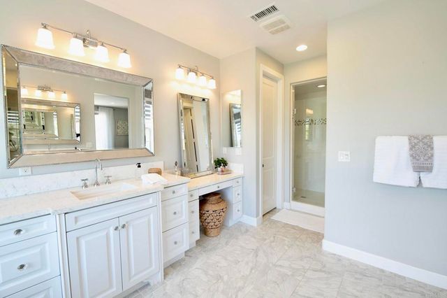 a bathroom with a sink and mirror