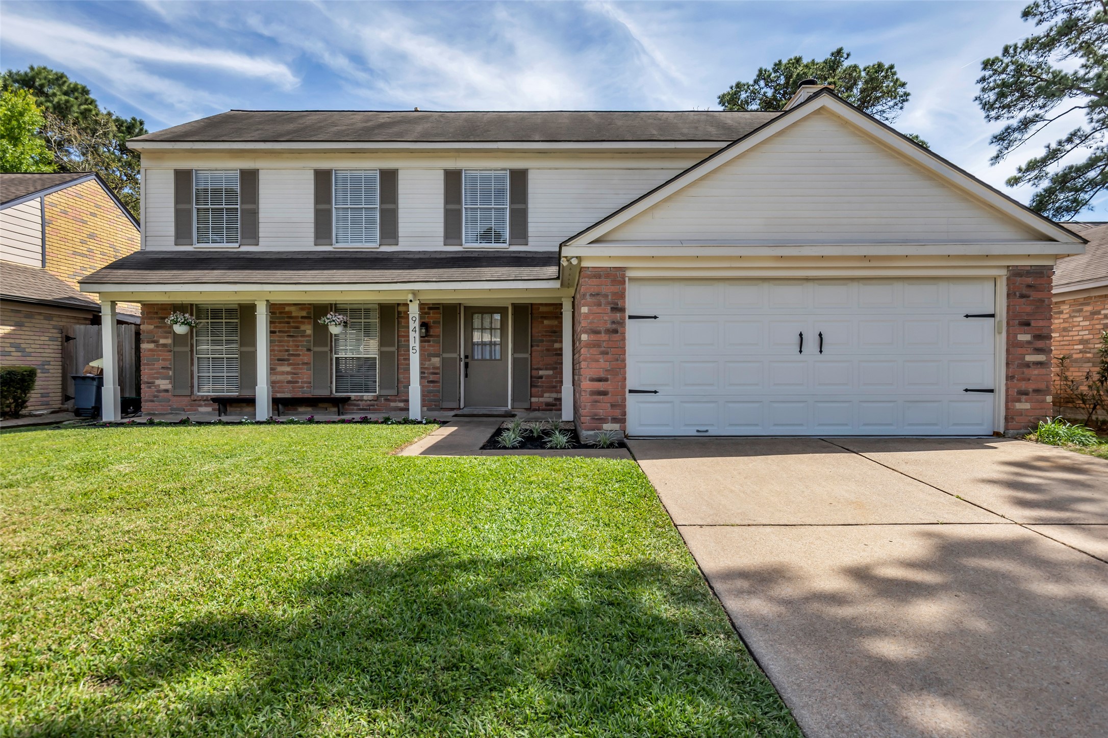9415 Towerstone Drive Spring, TX 77379 - Photo 1 of 41 Charming two-story brick home with a two-car garage, manicured lawn, and cozy front porch, perfect for family living.