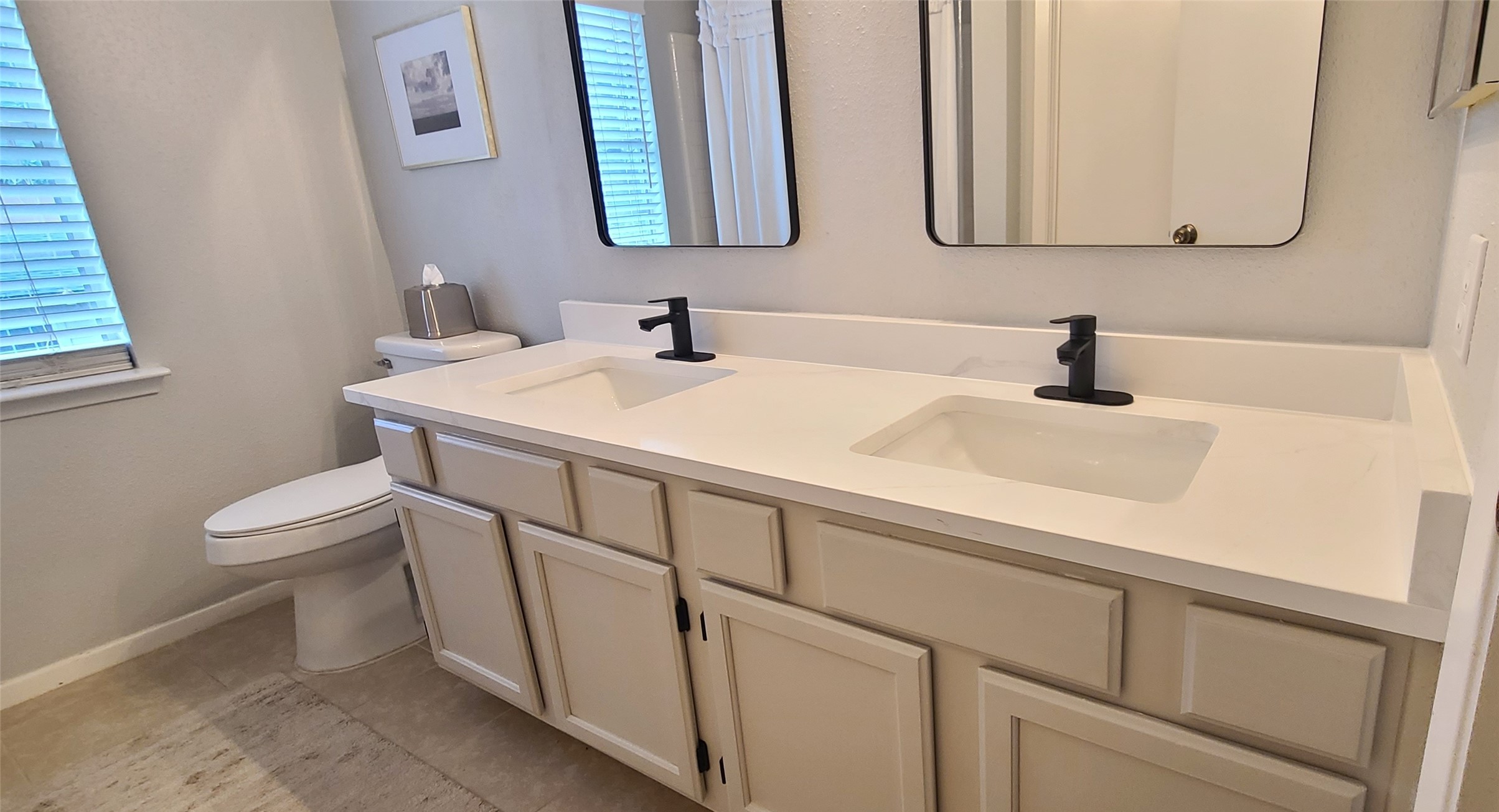 9415 Towerstone Drive Spring, TX 77379 - Photo 32 of 41 Dual vanities in the secondary bath with updated mirrors and fixtures.