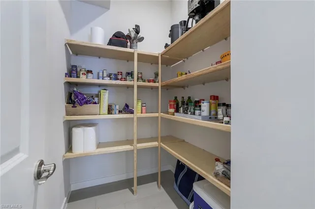 a view of room with cabinets and wooden floor
