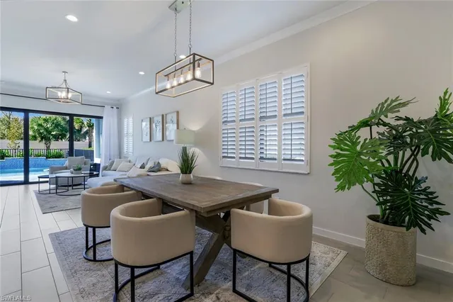 a view of a dining room with furniture window and outside view