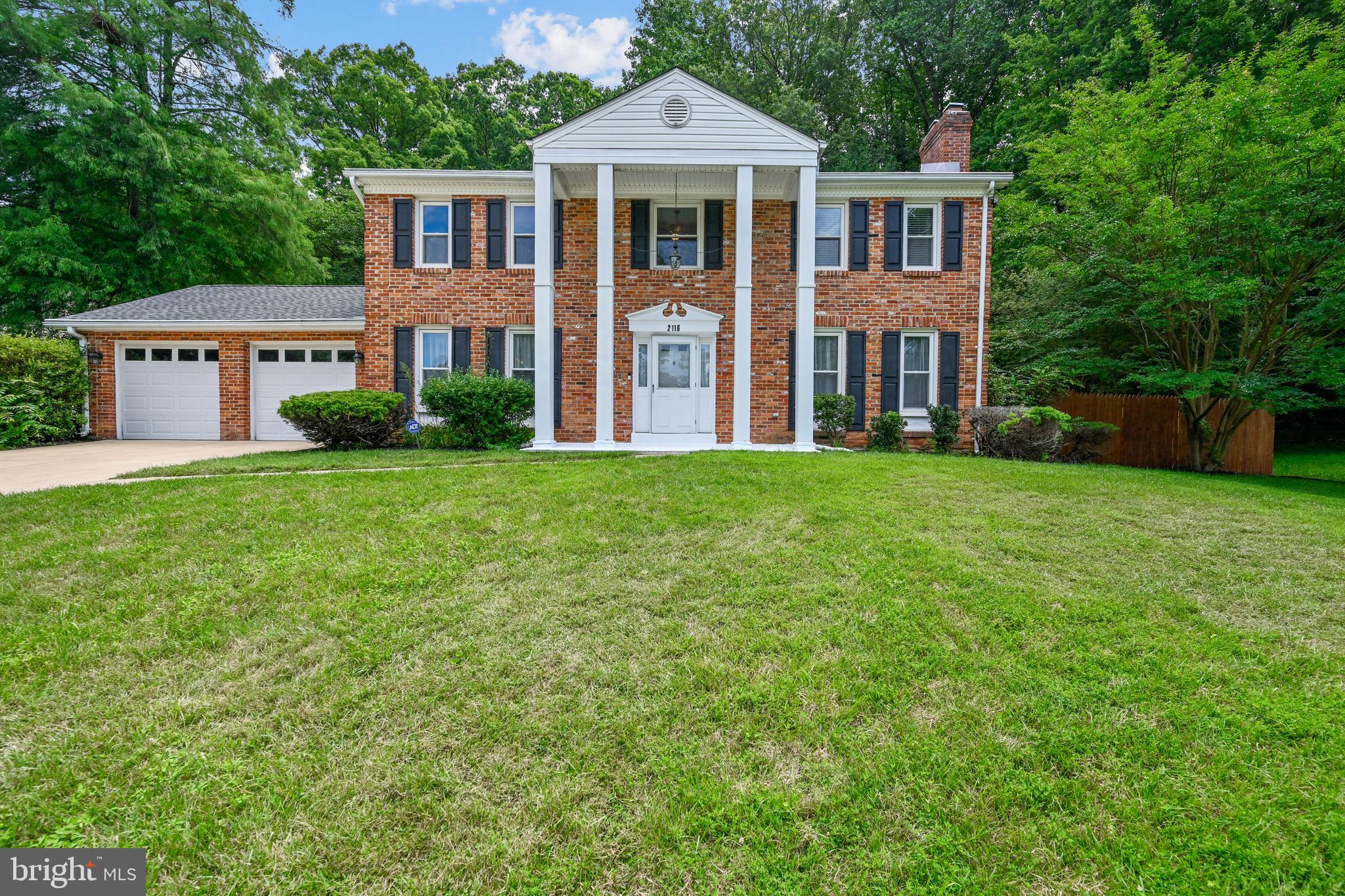 2116 Kings House Road Silver Spring, MD 20905 - Photo 1 of 37 a front view of a house with a yard