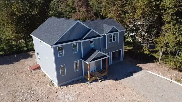 a house with trees in the background