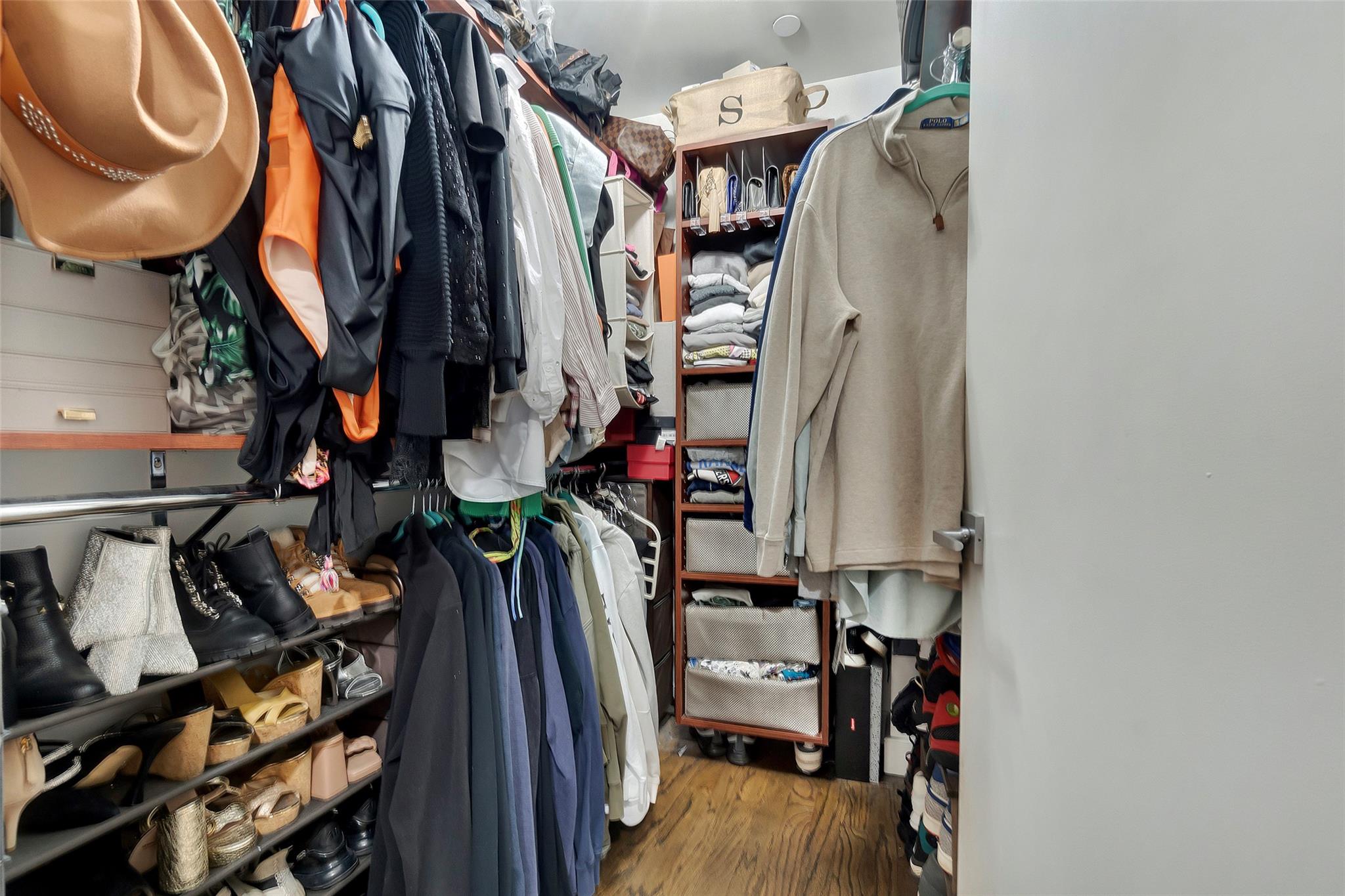 151 Beach 96th Street, Unit 5D Queens, NY 11693 - Photo 15 of 18 Walk in closet with wood finished floors