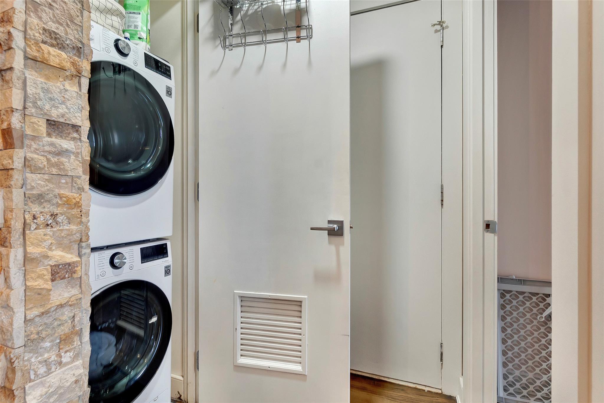 151 Beach 96th Street, Unit 5D Queens, NY 11693 - Photo 7 of 18 Laundry room with stacked washer / dryer, laundry area, and visible vents
