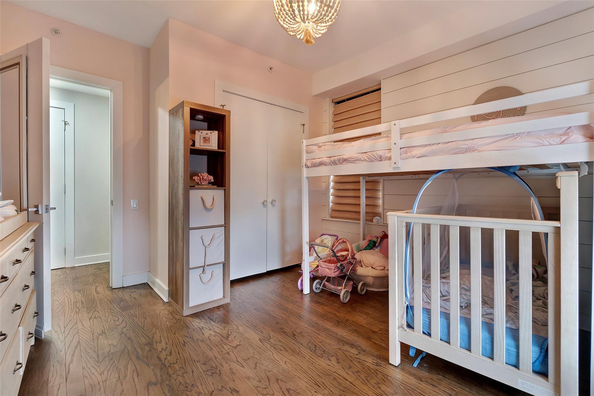 151 Beach 96th Street, Unit 5D Queens, NY 11693 - Photo 10 of 18 Bedroom with a chandelier and wood finished floors