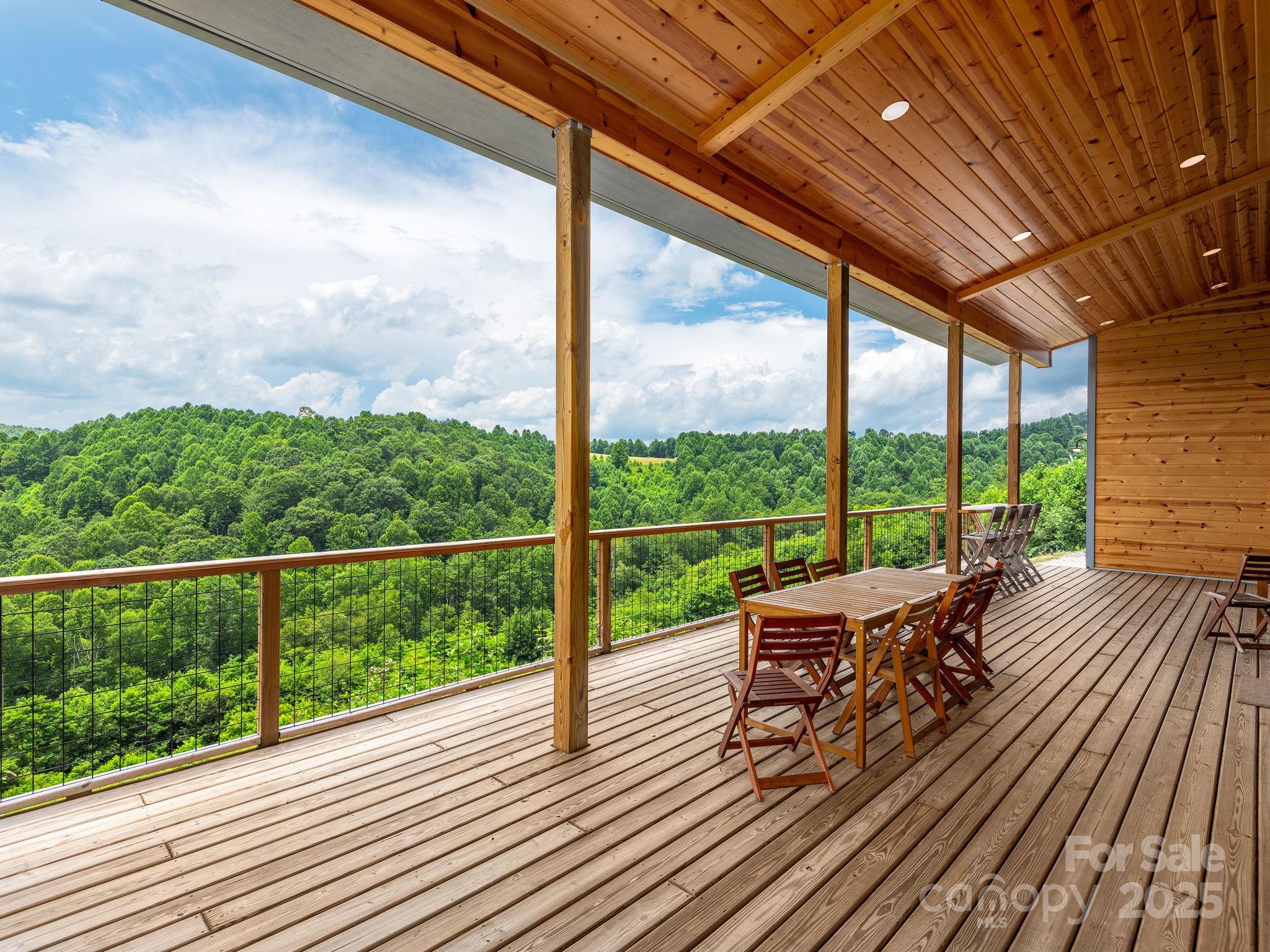 a view of a balcony with couch and wooden floor