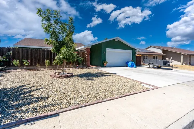 a building outdoor space with patio furniture and potted plants