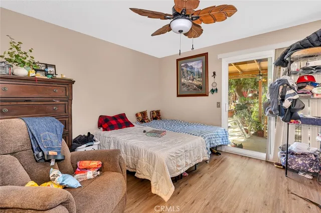 a bedroom with two beds and a window