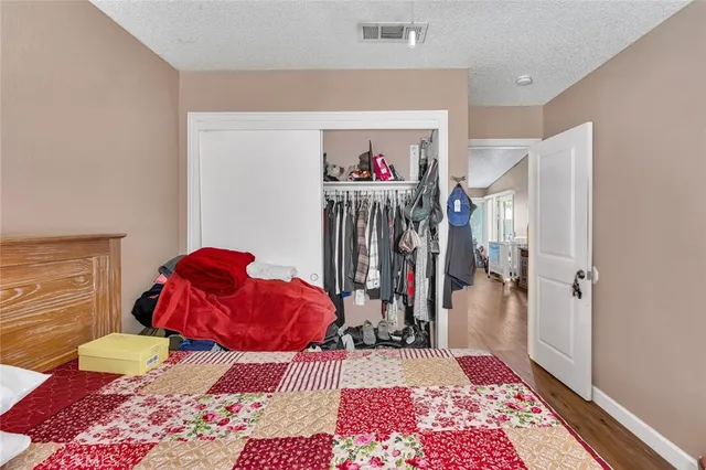 a view of a patio with a dining table and chairs with wooden floor