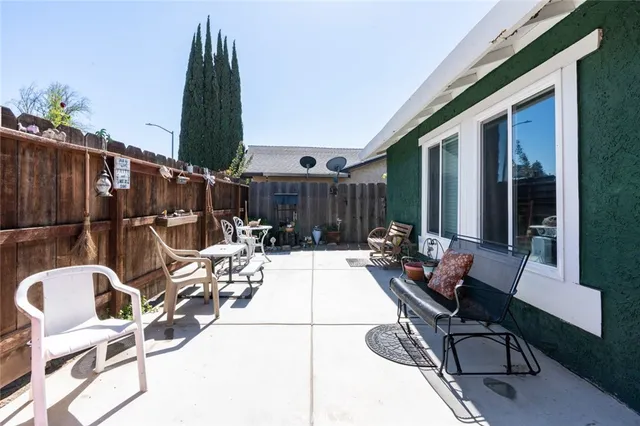 a view of a pathway of a house with a tree