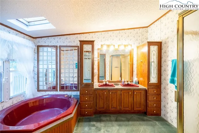 a view of room with window and wooden floor