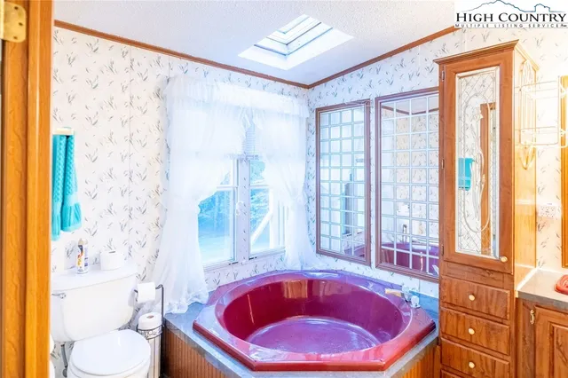 a view of a wooden deck with a big yard