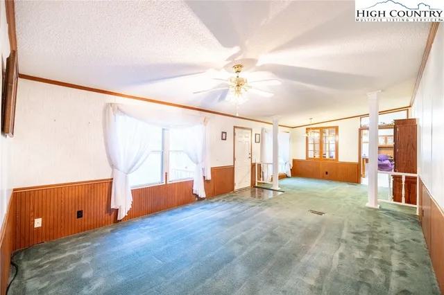 a view of a grassy field with trees