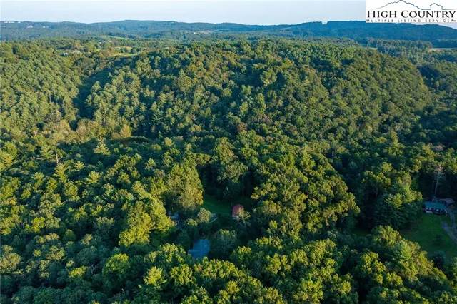 a view of empty room with fireplace