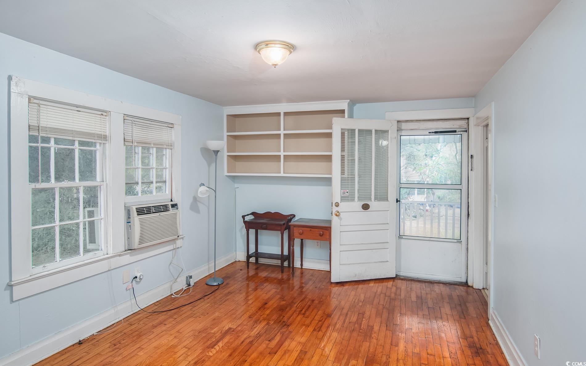 1010 Highmarket Street Georgetown, SC 29440 - Photo 27 of 32 Unfurnished room with hardwood / wood-style floors, an office area, and cooling unit
